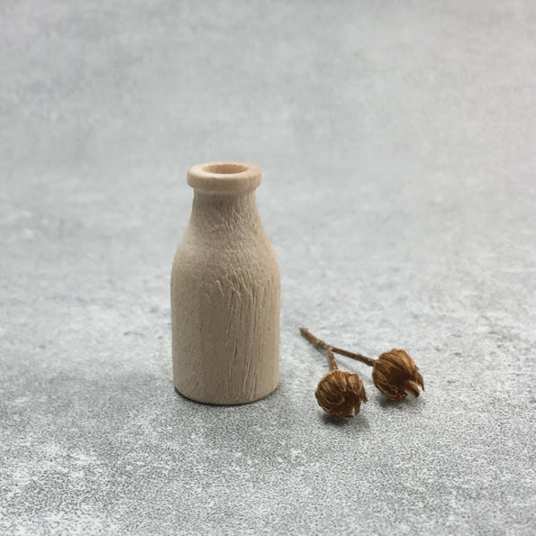 Tiny wooden milk bottle